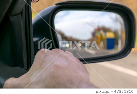 Hand man lying on the car door Hand man lying on the car door 47851810