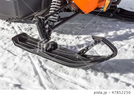 Snowmobile ride on snowy mountains and woods Snowmobile ride on snowy mountains and woods 47852250