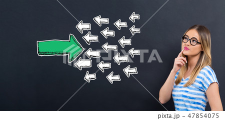 Arrow facing in a opposite direction with young woman Arrow facing in a opposite direction with young woman 47854075