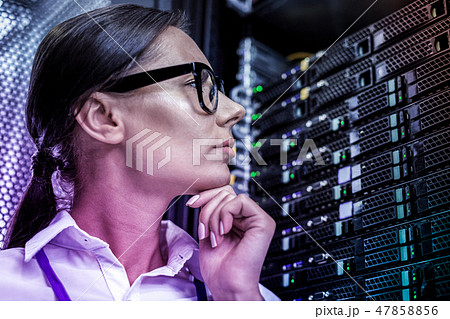 Portrait of a smart young woman thinking about information systems 47858856