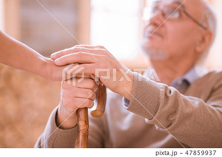Attentive mature man looking at his volunteer Attentive mature man looking at his volunteer 47859937