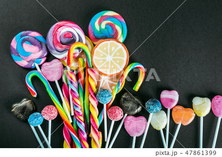 lollipops, candy, chewing gum and other sweets of different colors lollipops, candy, chewing gum and other sweets of different colors 47861399