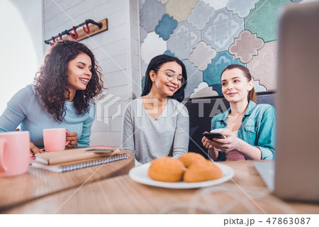 Pleasant positive women meeting in the cafe 47863087
