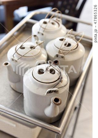 Traditional Chinese teapots on serving cart Traditional Chinese teapots on serving cart 47865326