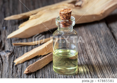 A bottle of white sandalwood essential oil 47865581
