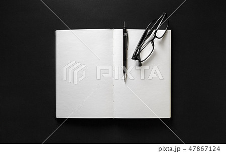 Book, glasses, pen 47867124