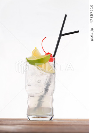 Cold alcohol cocktail with ice cubes 47867516