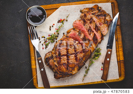 Succulent grilled large striploin steak 47870583