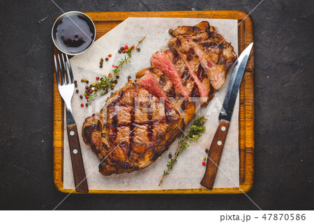 Succulent grilled large striploin steak 47870586