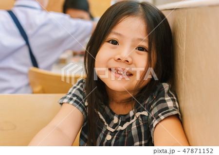 Cute Little Asian Girl in Restaurant. Cute Little Asian Girl in Restaurant. 47871152