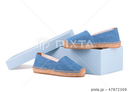 Shoe box and a pair of blue espadrilles Shoe box and a pair of blue espadrilles 47872309