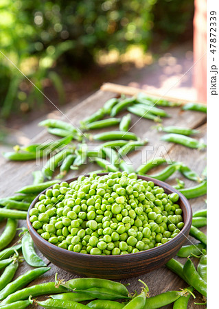 raw peas on the table raw peas on the table 47872339