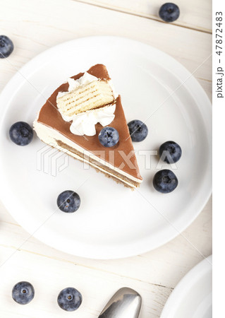 a piece of cake on a saucer 47872483