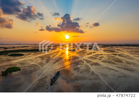sunset at a fishing boat in lagoon at Talay Noi sunset at a fishing boat in lagoon at Talay Noi 47874722