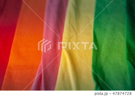 green yellow pink orange and red tee shirts. 47874728