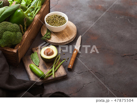 Assorted green toned raw organic vegetables 47875504