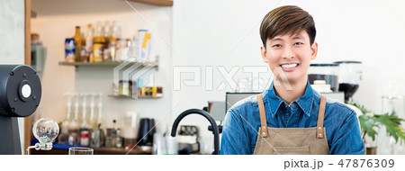 Cheerful male Asian entrepreneur in coffee shop Cheerful male Asian entrepreneur in coffee shop 47876309