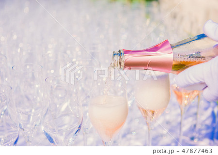 Waiter pouring champagne, sparkling wine 47877463