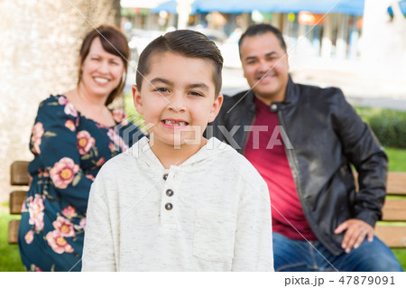 Mixed Race Young Family Portrait At The Park 47879091