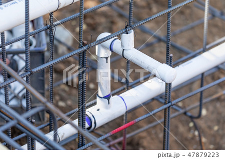 Newly Installed PVC Plumbing Pipes and Steel Rebar Newly Installed PVC Plumbing Pipes and Steel Rebar 47879223