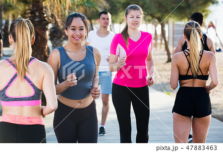 People jogging on city seafront People jogging on city seafront 47883463