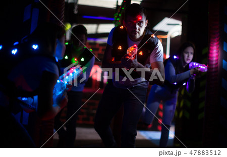Young man on laser tag arena 47883512