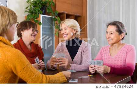 Female pensioners playing cards Female pensioners playing cards 47884624