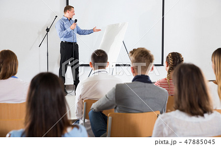 Male teacher lecturing to students Male teacher lecturing to students 47885045