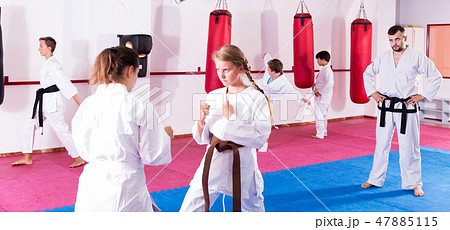 Children working in pair mastering new karate moves 47885115