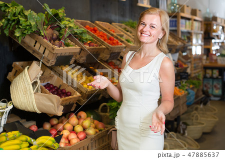 female customer choosing vegetables and fruits. female customer choosing vegetables and fruits. 47885637