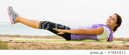 Girl training on seaside Girl training on seaside 47885811