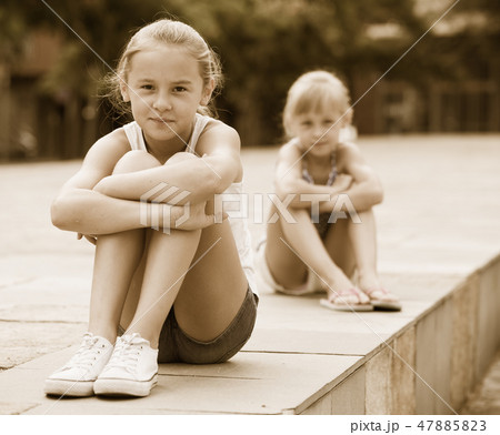 Small sisters upset after quarrel outside 47885823