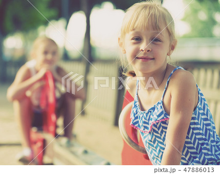 Portrait of happy girl outdoors 47886013