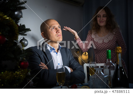 Couple quarreling at Christmas night 47886511