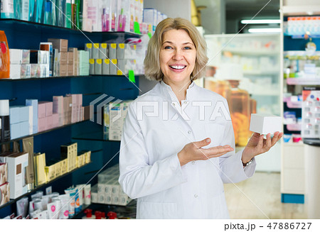female pharmacist posing in drugstore 47886727