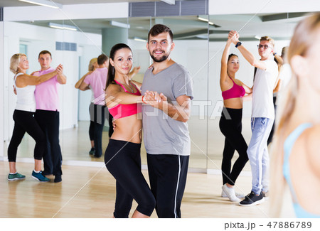 smiling young adults dancing salsa smiling young adults dancing salsa 47886789