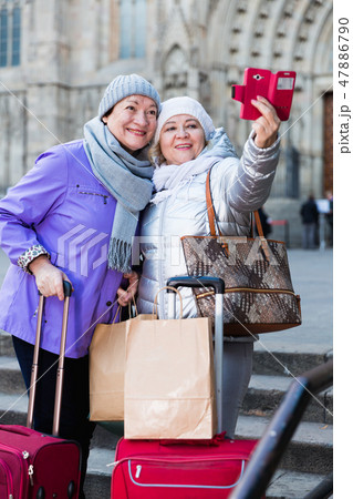 Senior females travelers taking selfie Senior females travelers taking selfie 47886790