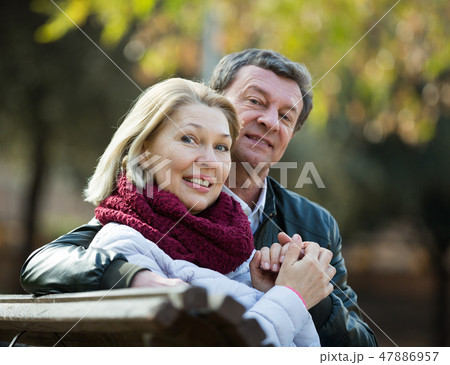 Portrait of elderly couple in park Portrait of elderly couple in park 47886957