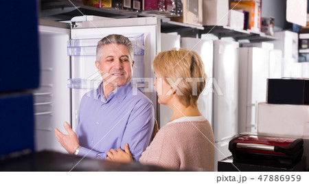 Pretty mature married couple choose for themselves refrigerator Pretty mature married couple choose for themselves refrigerator 47886959