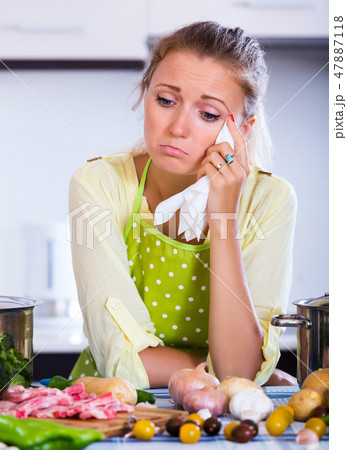 Frustrated girl looking at ingredients Frustrated girl looking at ingredients 47887118