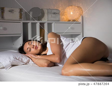 Sexy girl in panties sleeping on white sheet in... - Stock Photo [47887264]  - PIXTA