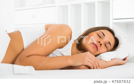 Woman sleeping in bed Woman sleeping in bed 47887832