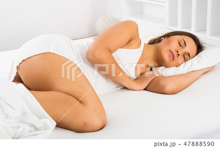 Woman sleeping in bed Woman sleeping in bed 47888590
