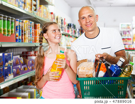 Family with shopping basket in grocery Family with shopping basket in grocery 47889016