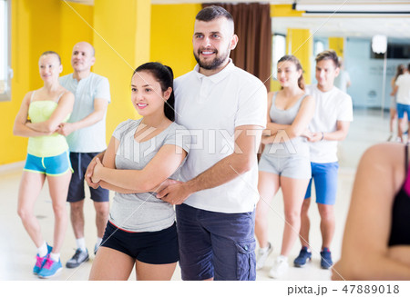 Group of happy people dancing salsa together 47889018