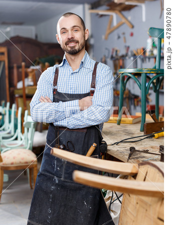 Cheerful craftsman posing in studio Cheerful craftsman posing in studio 47890780