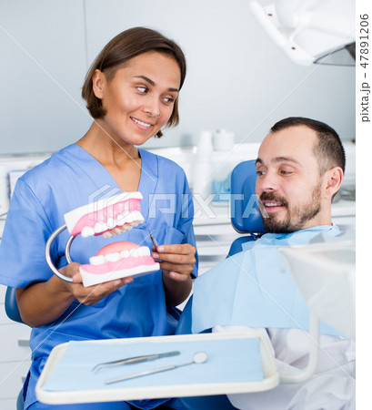 Orthodontist is telling about hygiene Orthodontist is telling about hygiene 47891206