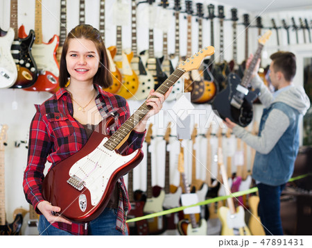 Young visitors are deciding on suitable amp Young visitors are deciding on suitable amp 47891431