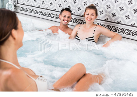Three friends relaxing at spa, enjoying company 47891435