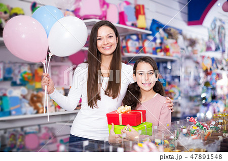 female and girl with gifts and balloons female and girl with gifts and balloons 47891548